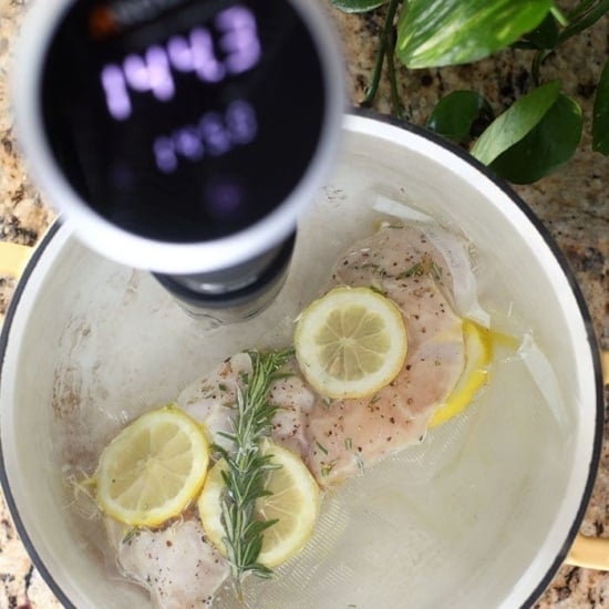 sous vide chicken in pot of water.