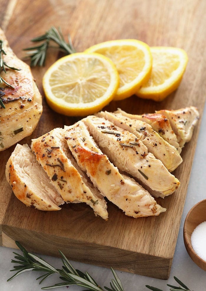 Chicken breasts on a cutting board.