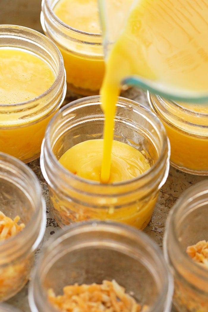pouring egg mixture into jars