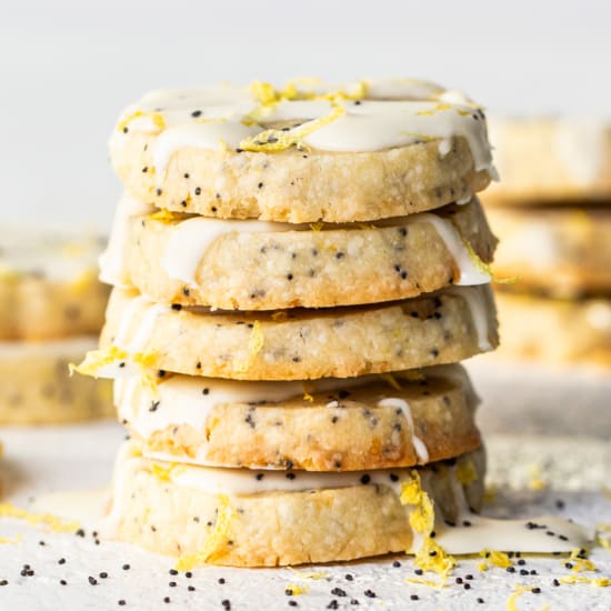 Lemon poppy seed cookies with icing and sprinkles.