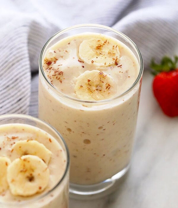 a banana smoothie in a glass