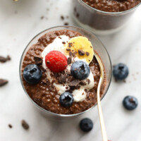 Chocolate chia seed pudding with berries and whipped cream.