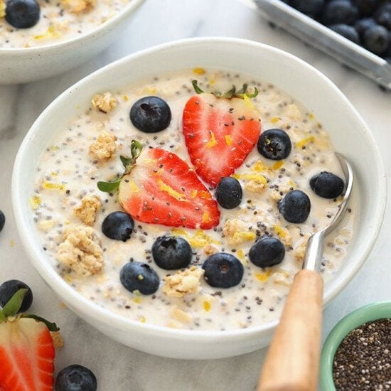 a bowl of chia pudding with berries and blueberries, similar to overnight oats.