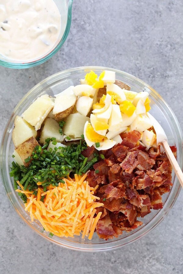 Loaded Baked Potato Salad ingredients in bowl
