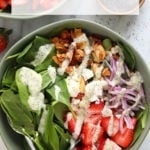 A bowl of strawberry spinach salad