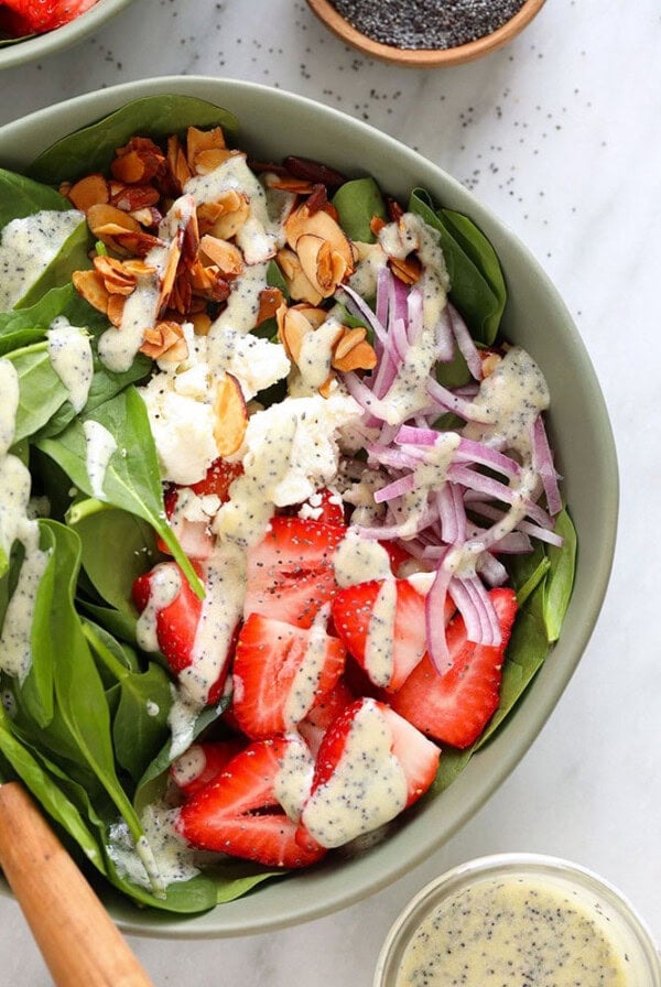 A bowl of strawberry spinach salad
