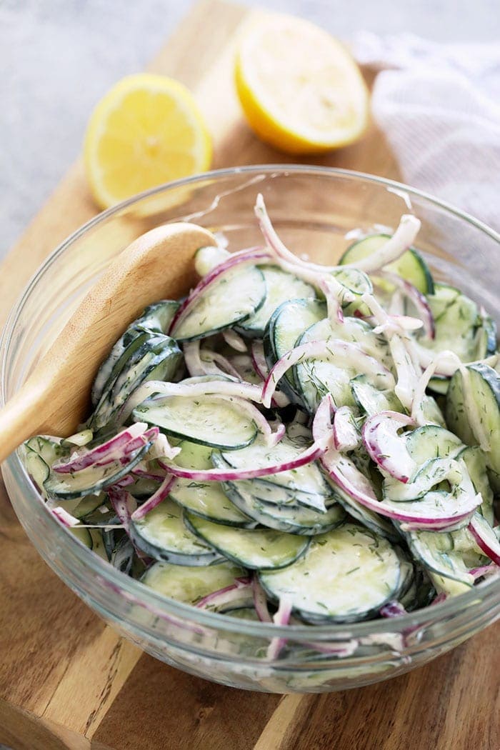 Creamy cucumber salad in a bowl.