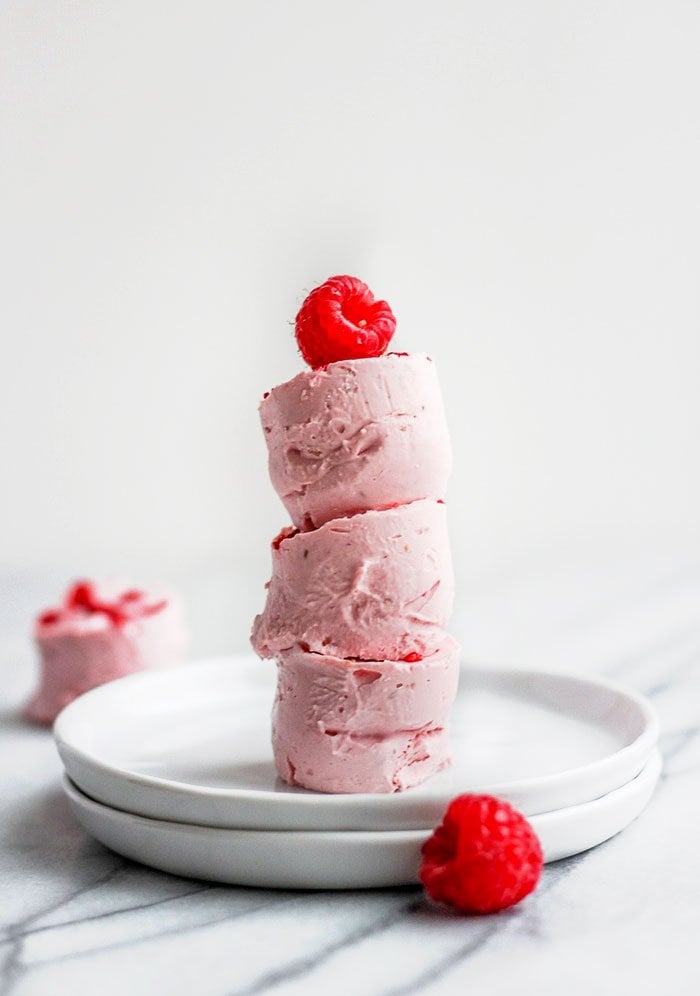 Fat bombs stacked with raspberry on top