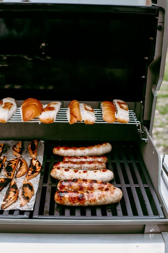 brats and buns on grill