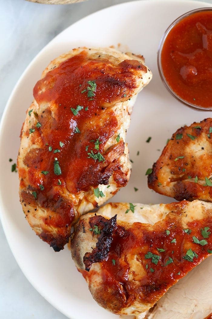 Grilled bbq chicken breast with bbq sauce. 