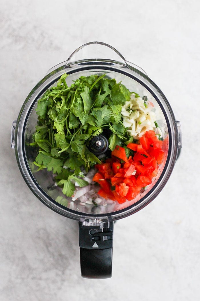 chimichurri sauce ingredients in a food processor 