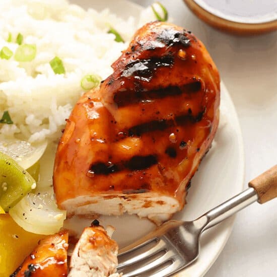 A plate of Grilled Teriyaki Chicken with rice and vegetables.