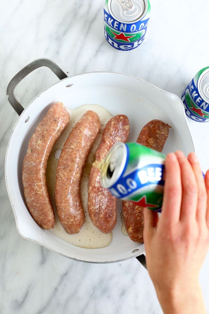 uncooked brats in pan