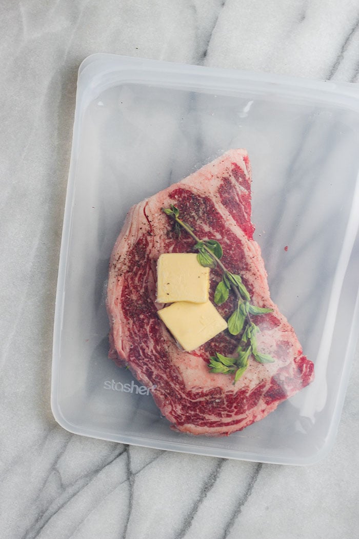 Steak in a stasher bag with butter and herbs. 