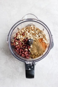 a food processor filled with black bean burger ingredients.