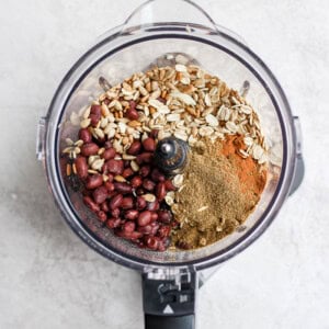 a food processor filled with black bean burger ingredients.