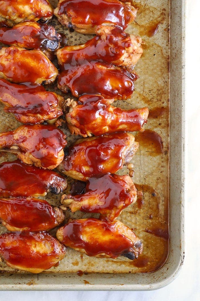 barbecue crockpot wings on a baking sheet
