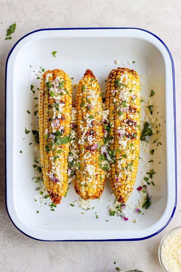 grilled Mexican corn in tin.
