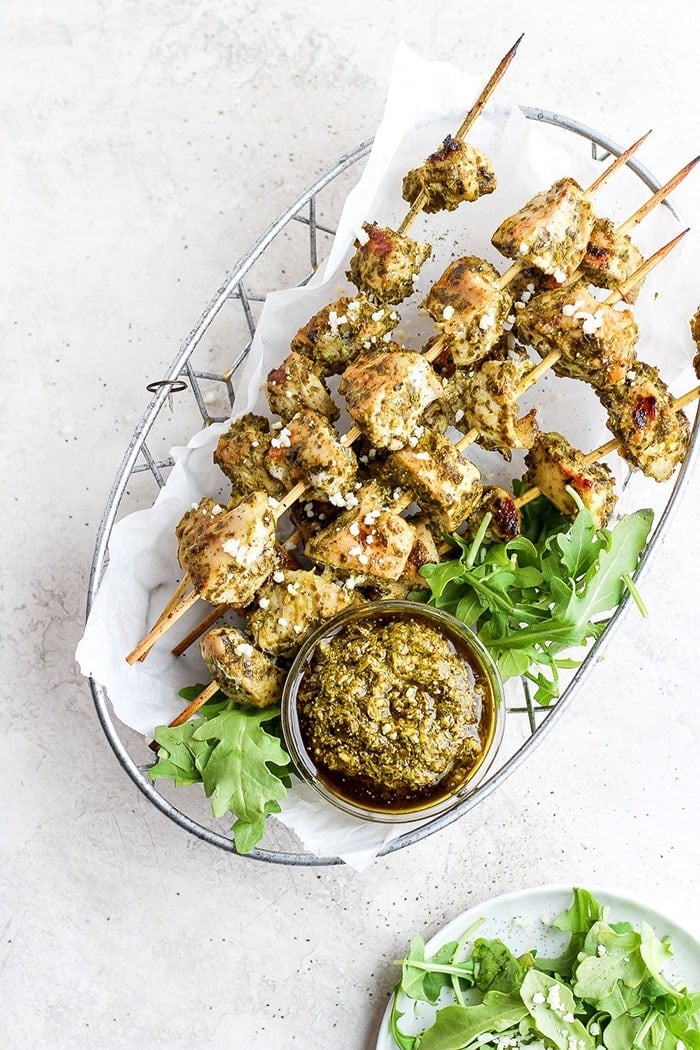 chicken skewers in a basket.