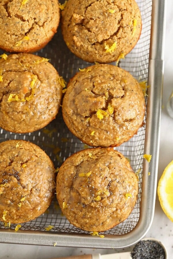 Lemon chia muffins on a baking sheet, featuring zesty lemon and nutritious chia seeds.