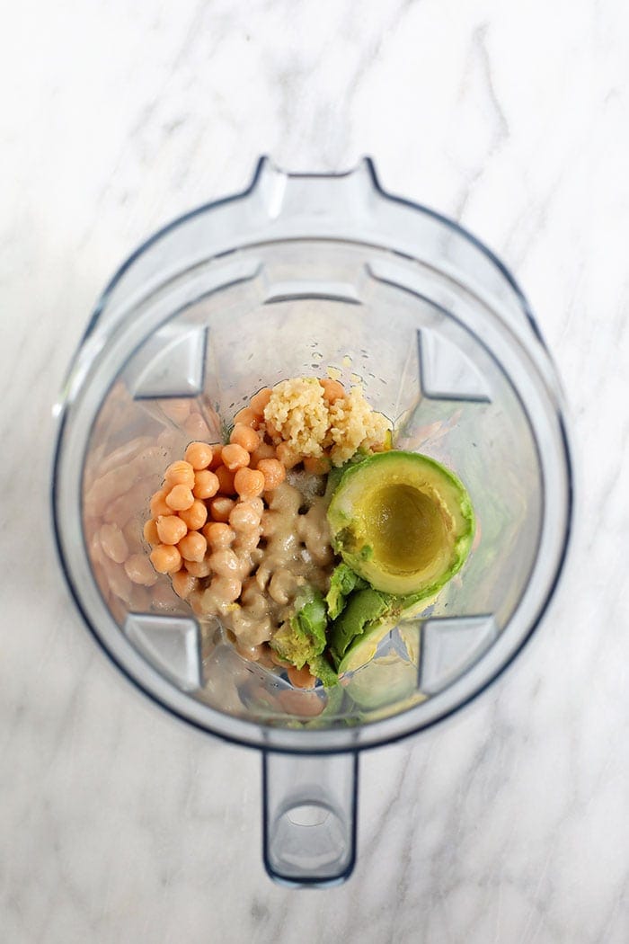 avocado hummus ingredients in a blender