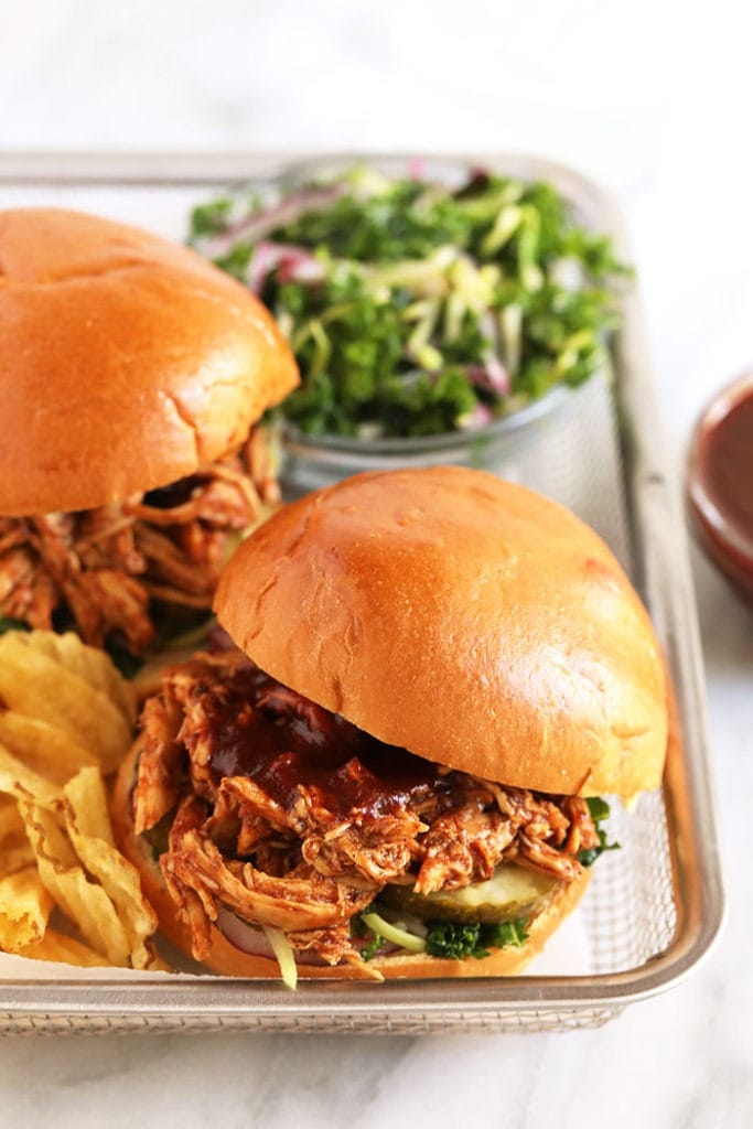 pulled bbq chicken on bun with chips