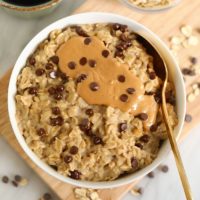 Microwave oatmeal topped with peanut butter and chocolate chips.