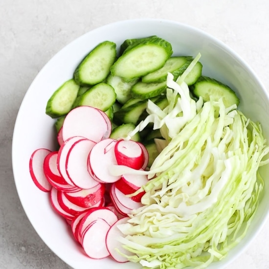 ahi poke bowl with radishes and cucumbers.