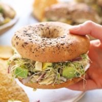 avocado tuna salad sandwich on a bagel