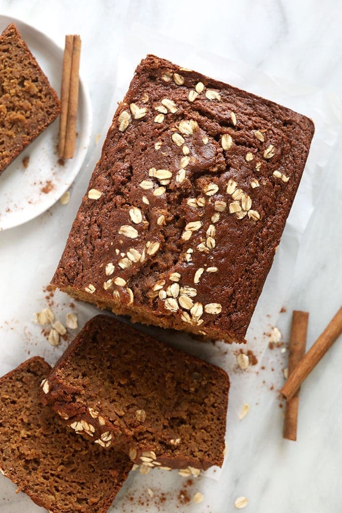 Cinnamon apple bread loaf sliced on a plate.