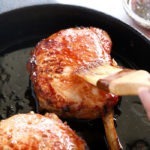 pork chops on cast iron skillet
