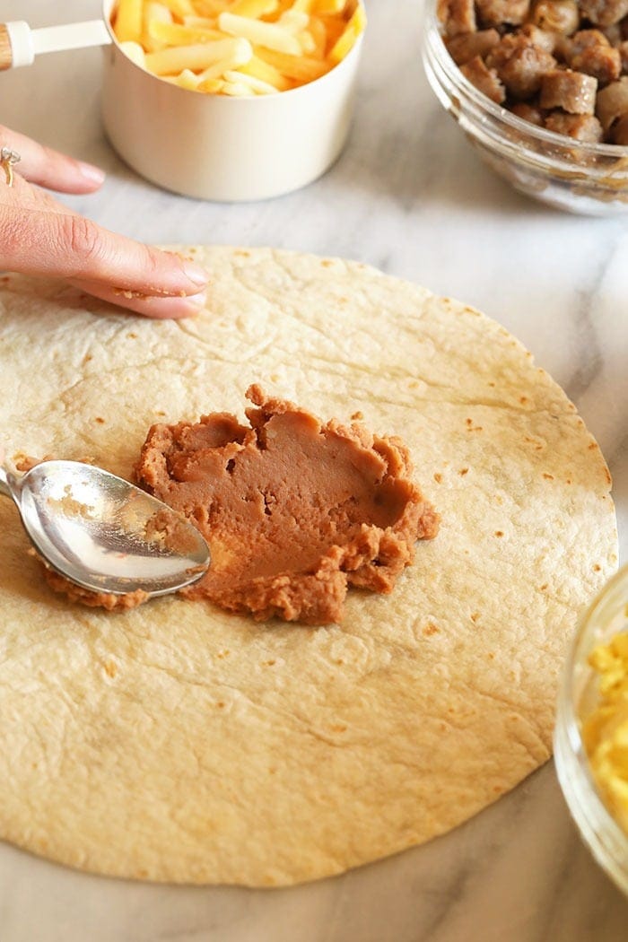 Preparing fajita breakfast burritos