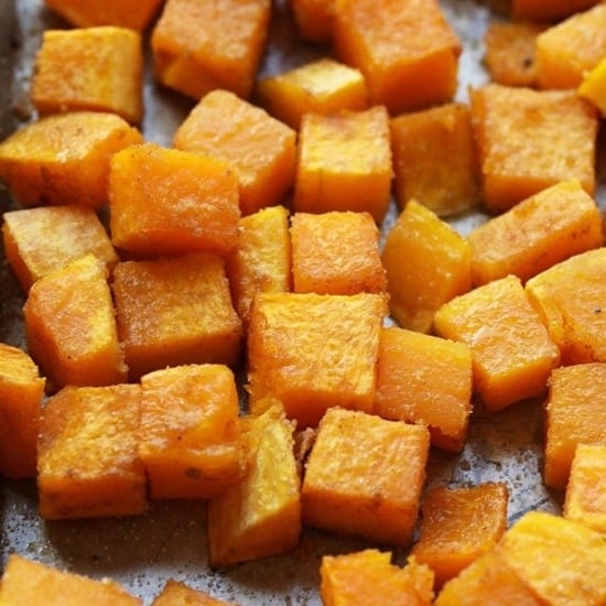 cubed roasted butternut squash on tray