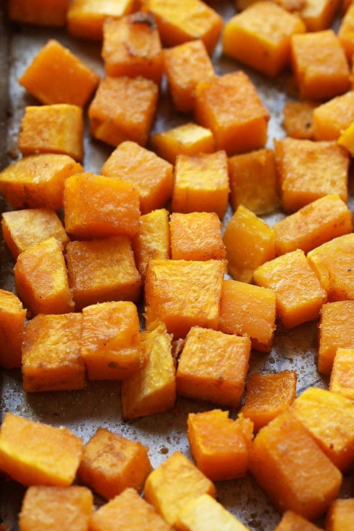 cubed roasted butternut squash on tray