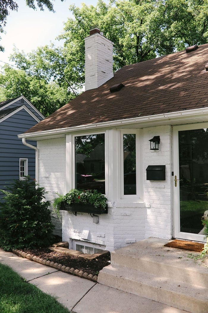 white brick house with black accents