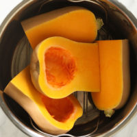 Instant Pot Butternut Squash cooked in a stainless steel pot.