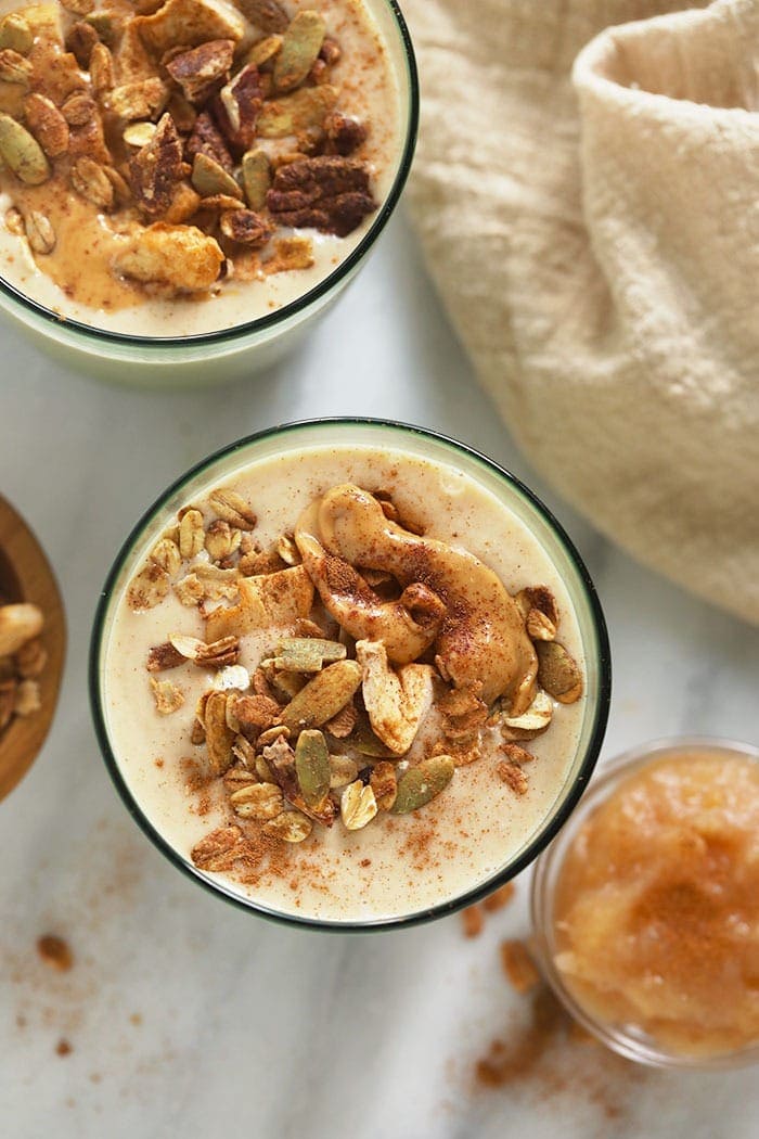 apple smoothie topped with nut butter and granola