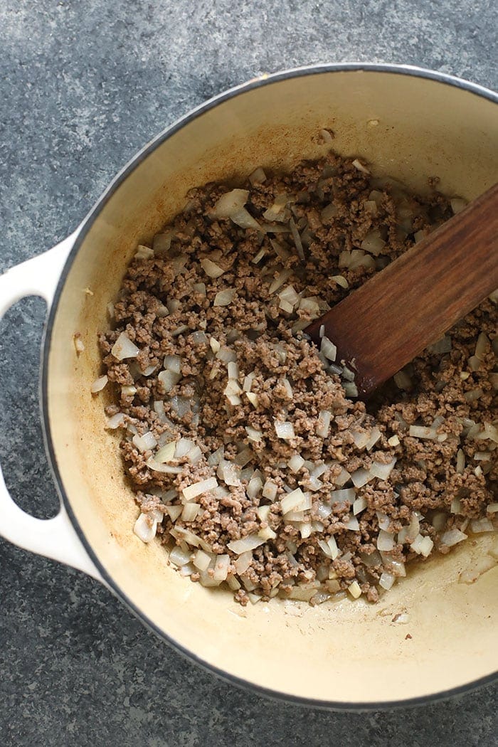 beef and onions in stockpot