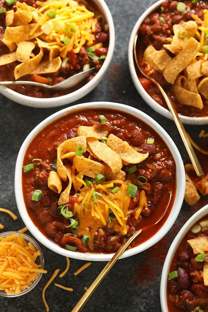 bowl of beef chili with cheese on top