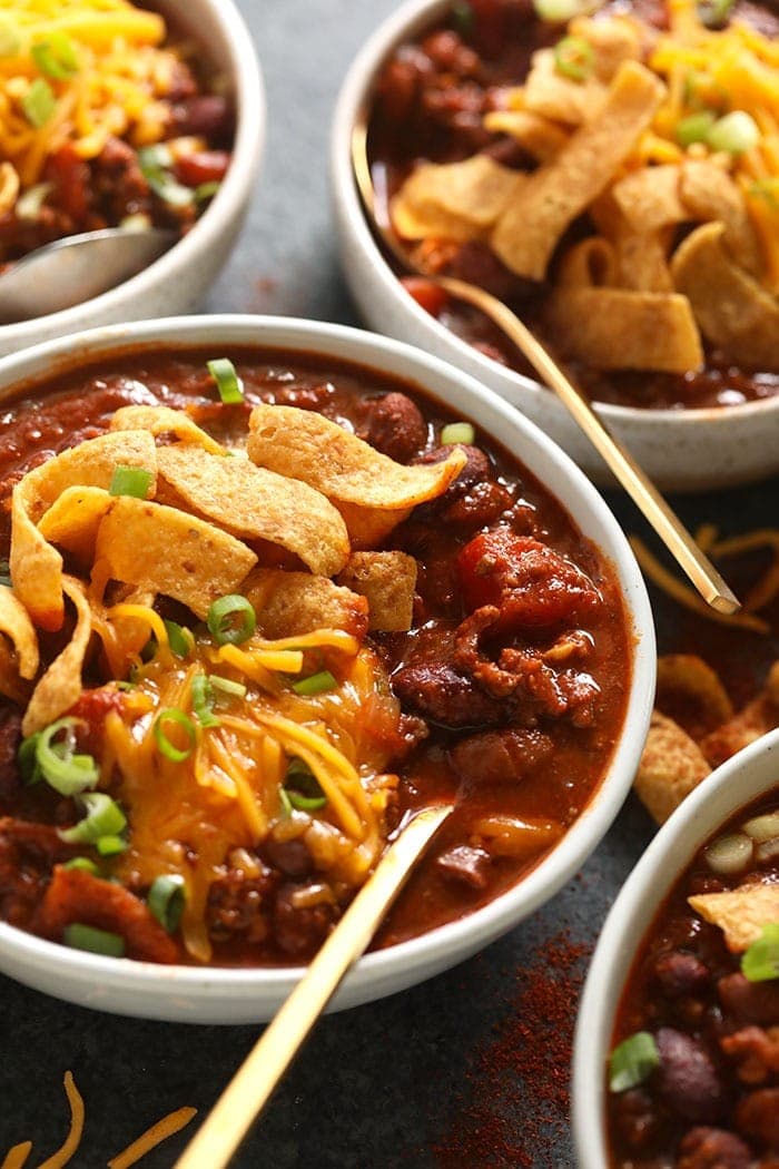 bowl of beef chili with Fritos and shredded cheese