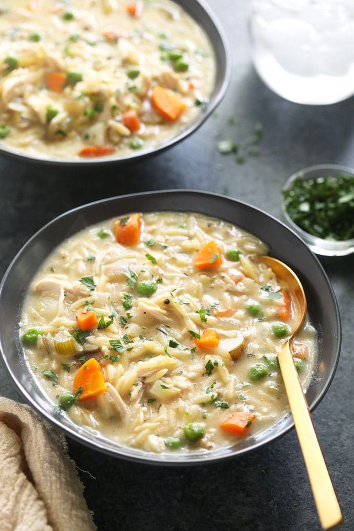 Creamy Chicken Noodle Soup is a healthy dinner idea that the whole family will love. It's packed with tons of protein and veggies and is creamy as can be! creamy chicken noodle soup in bowl