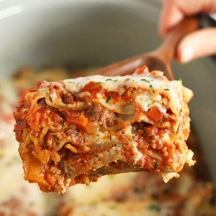 Crock pot lasagna on a spoon.