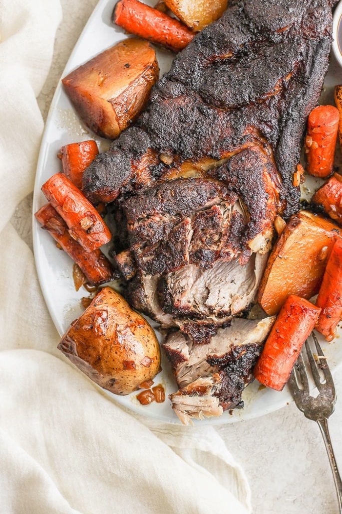 slow cooker pork roast on plate.