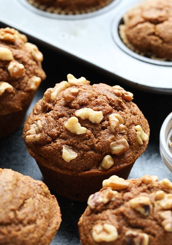 pumpkin muffins with walnuts in a pan.