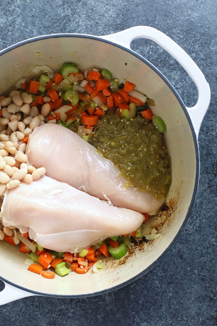 Ingredients for the spicy noodle soup in a dutch oven