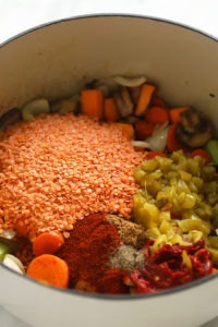 a bowl filled with sweet potato and lentil stew.