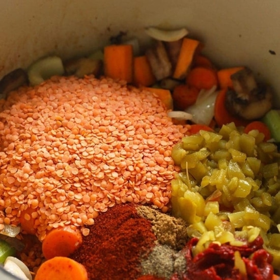 a bowl filled with sweet potato and lentil stew.