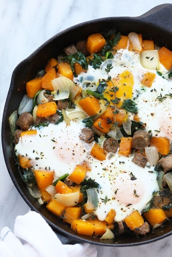 A skillet filled with a butternut squash breakfast hash.