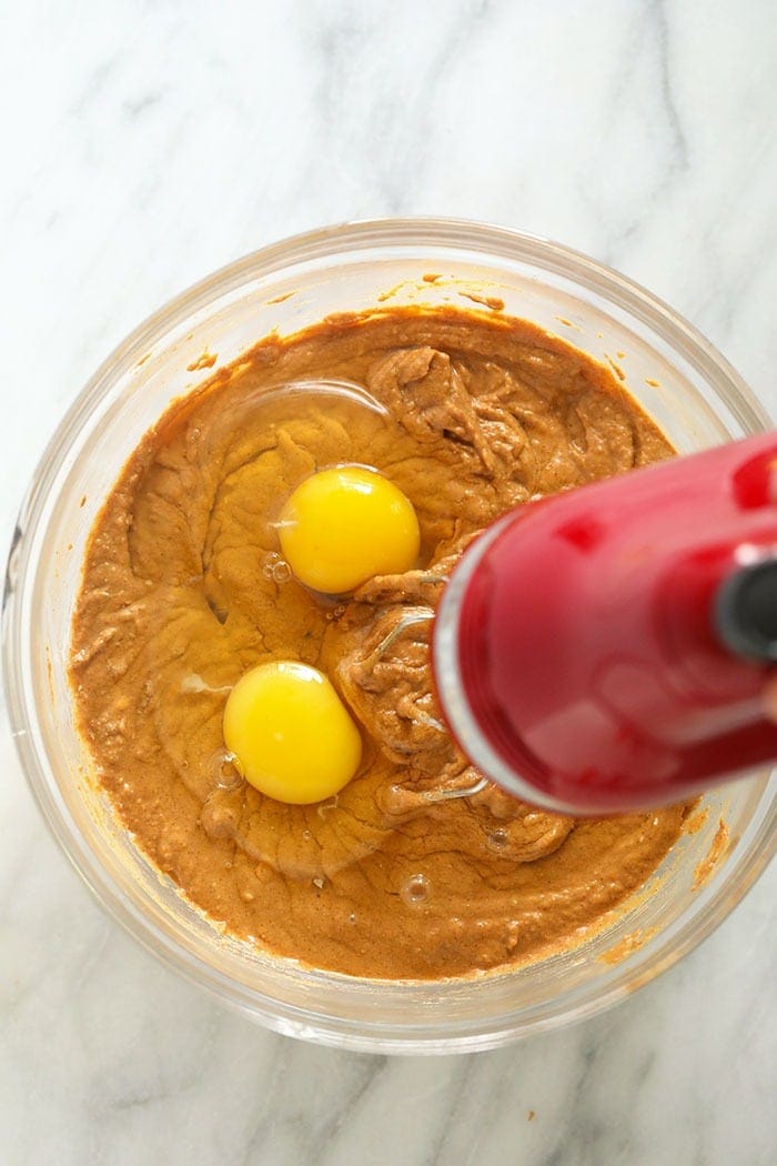 pumpkin cheesecake bar filling being mixed in a bowl