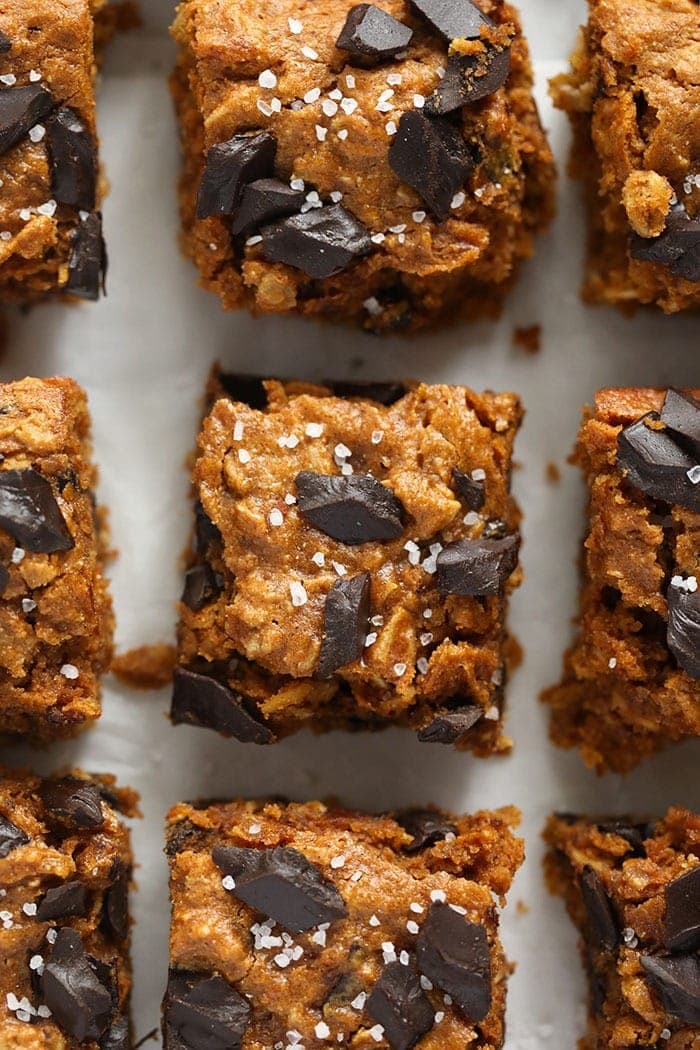 Say hello to the more glorious fall dessert you've ever tasted -- Pumpkin Oatmeal Cookie Bars made with maple syrup, cashew butter, and pumpkin puree! pumpkin cookie bars with sea salt on top